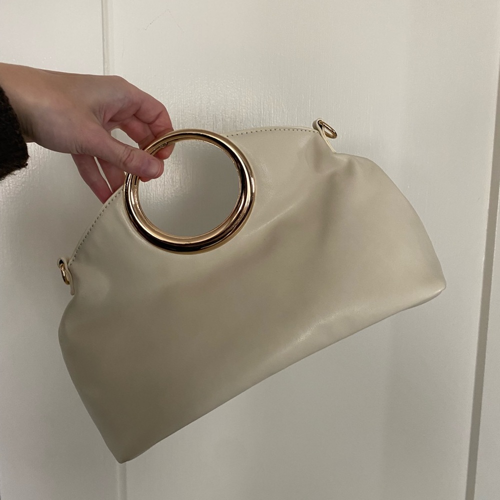 Elegant Cream Handbag with Gold Accents